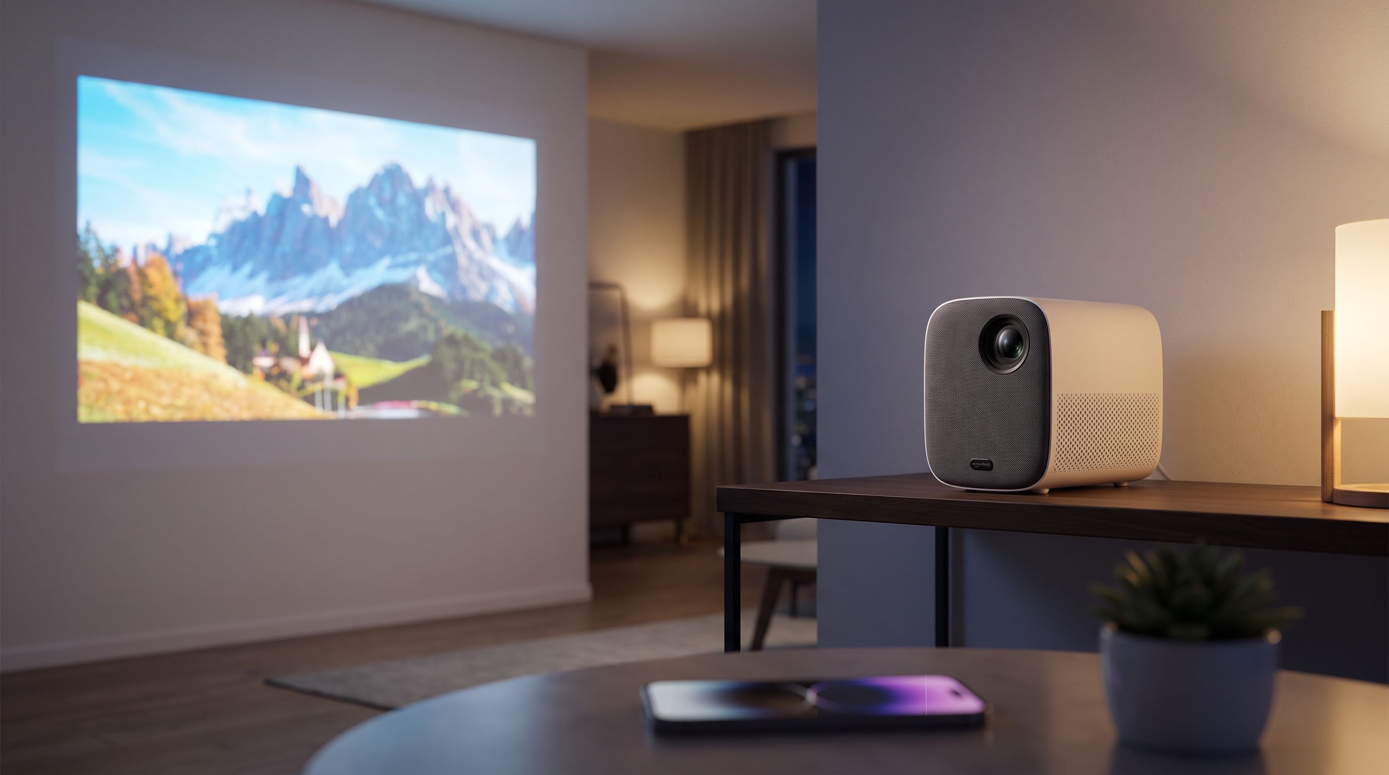 A compact all-in-one projector with integrated speakers sitting on a shelf, projecting a bright movie scene onto a living room wall at night